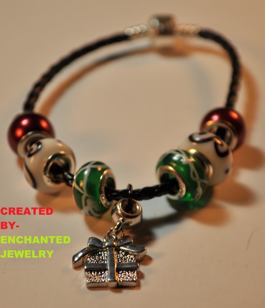 “A True Christmas Present”-Bracelet
	
This is a True Christmas Present!! It is a bracelet featured on a Black Braided Cord. This is a one of a kind, Christmas bracelet made by EnchantedJewelry. 
This product is Already made and Ready to Ship As Soon As you Order.
PRICE$10