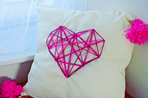DIY geometric heart cushion 

YOU WILL NEED :

– A cushion / pillow cover (homemade or ready-made)
– Something to fill it with (fluff or a cushion)
– An A4 piece of paper
– A marker
– A ruler
– A needle big enough for wool
– Wool in any colour you fancy
– An embroidery hoop
– Scissors